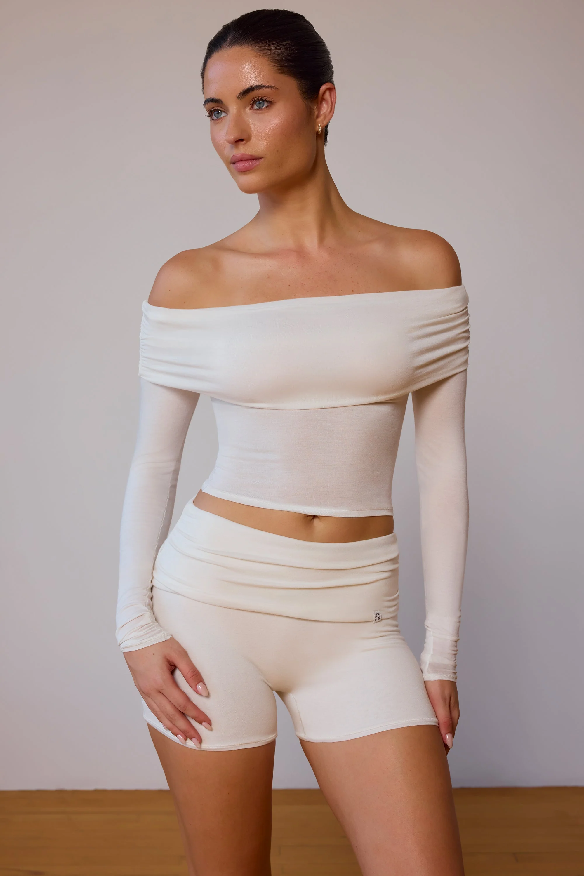 Refined Sheer Off-Shoulder Long-Sleeve Top in Soft White Natural